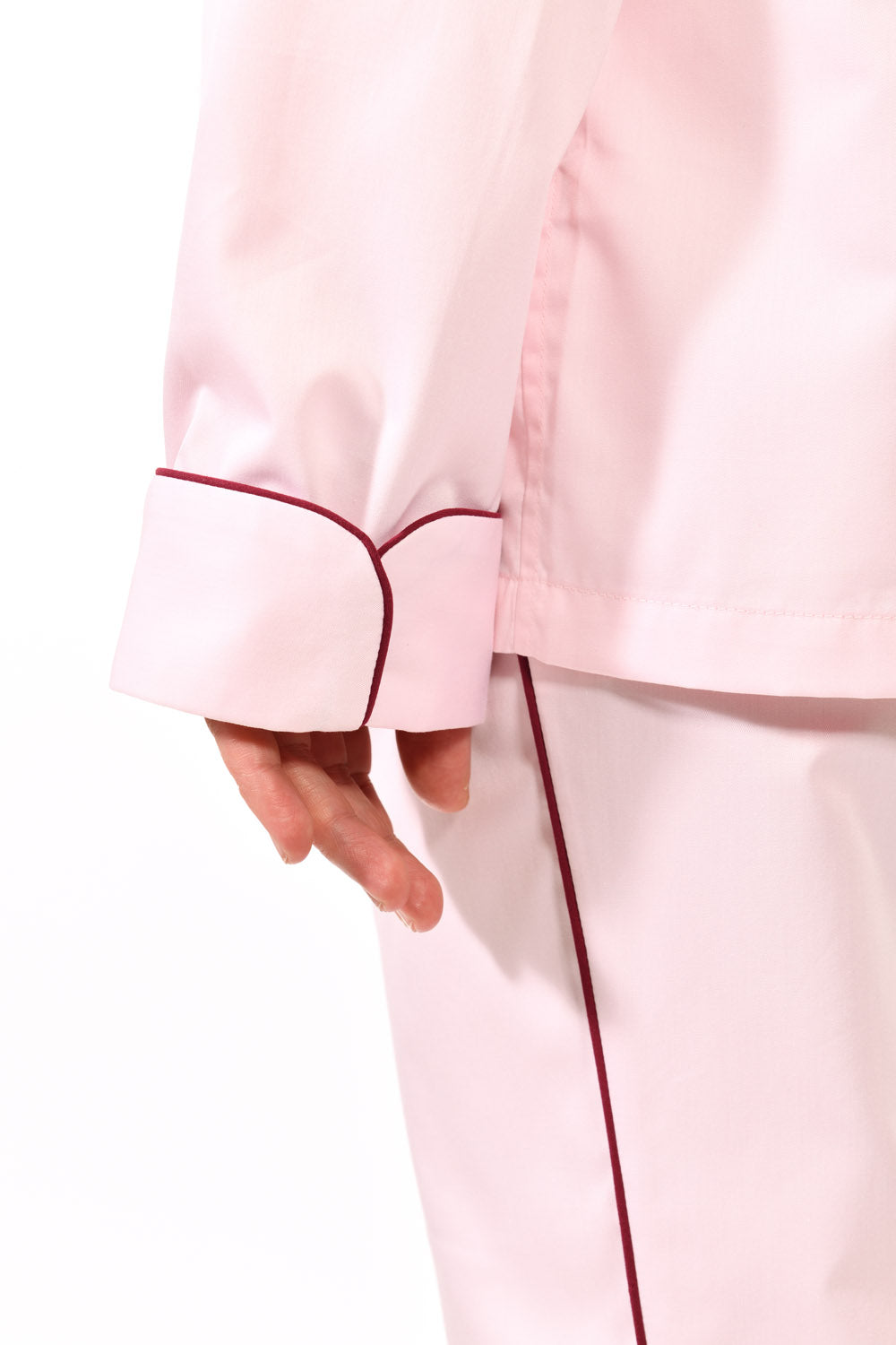 The Waldorf in light pink cotton broadcloth with burgundy piping